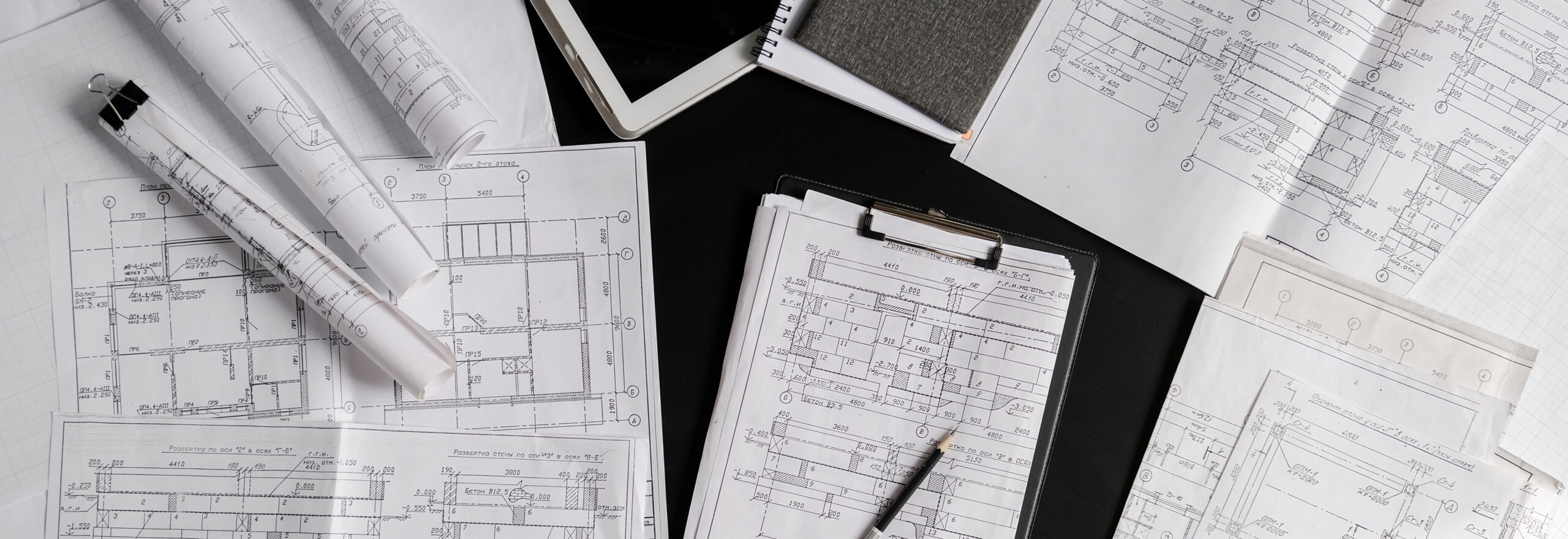 Architect works remotely from home in quarantine, lockdown covid 19 coronavirus. Remote work, stay home, new normality, social distance. Architect design working drawing sketch plans blueprints